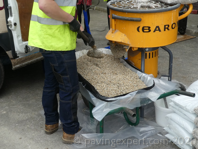 barrow loaded with freshly mixed material